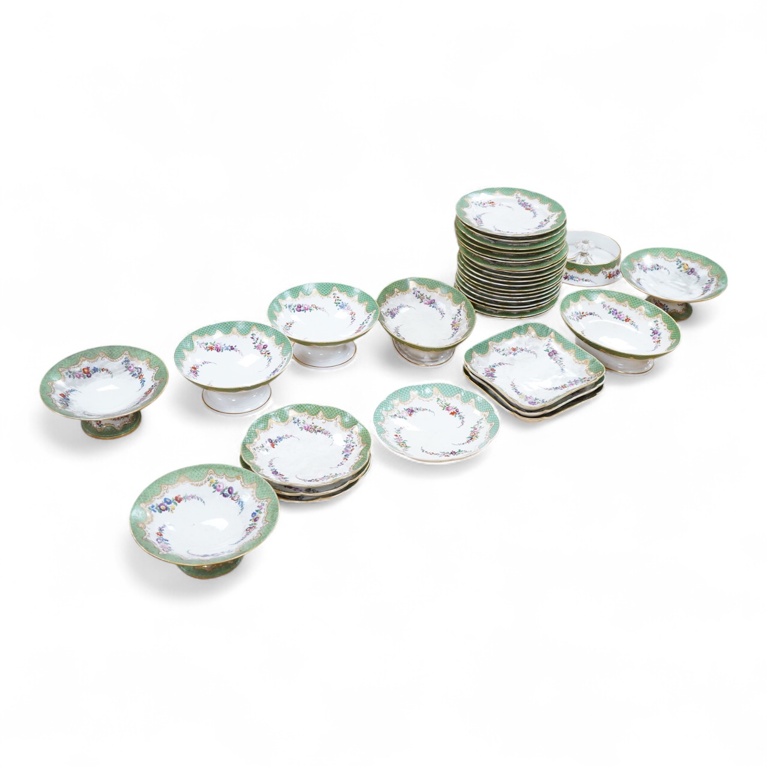 A 19th century French Paris porcelain part dessert service with green scale borders by Nast Paris, largest 26cm wide
